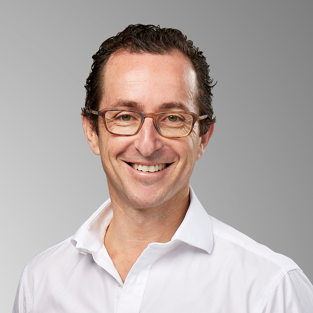 Headshot of Dan Greengarten.