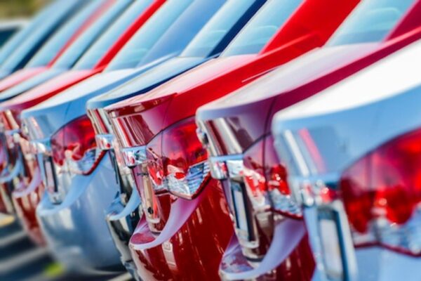 A group of cars parked in a row.