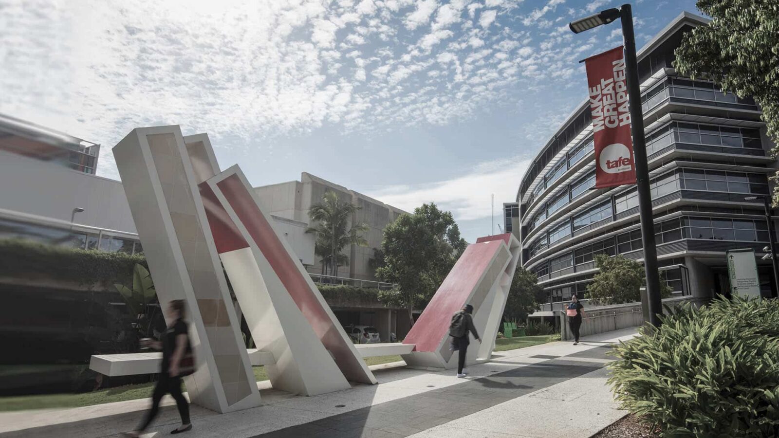 Students walking on a TAFE Queensland campus.