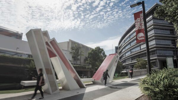 Students walking on a TAFE Queensland campus.
